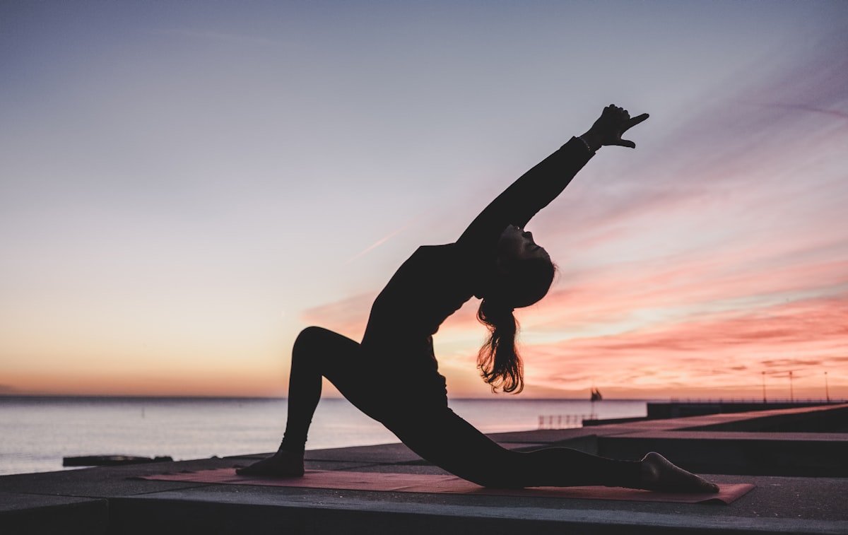 Person stretching at their office desk