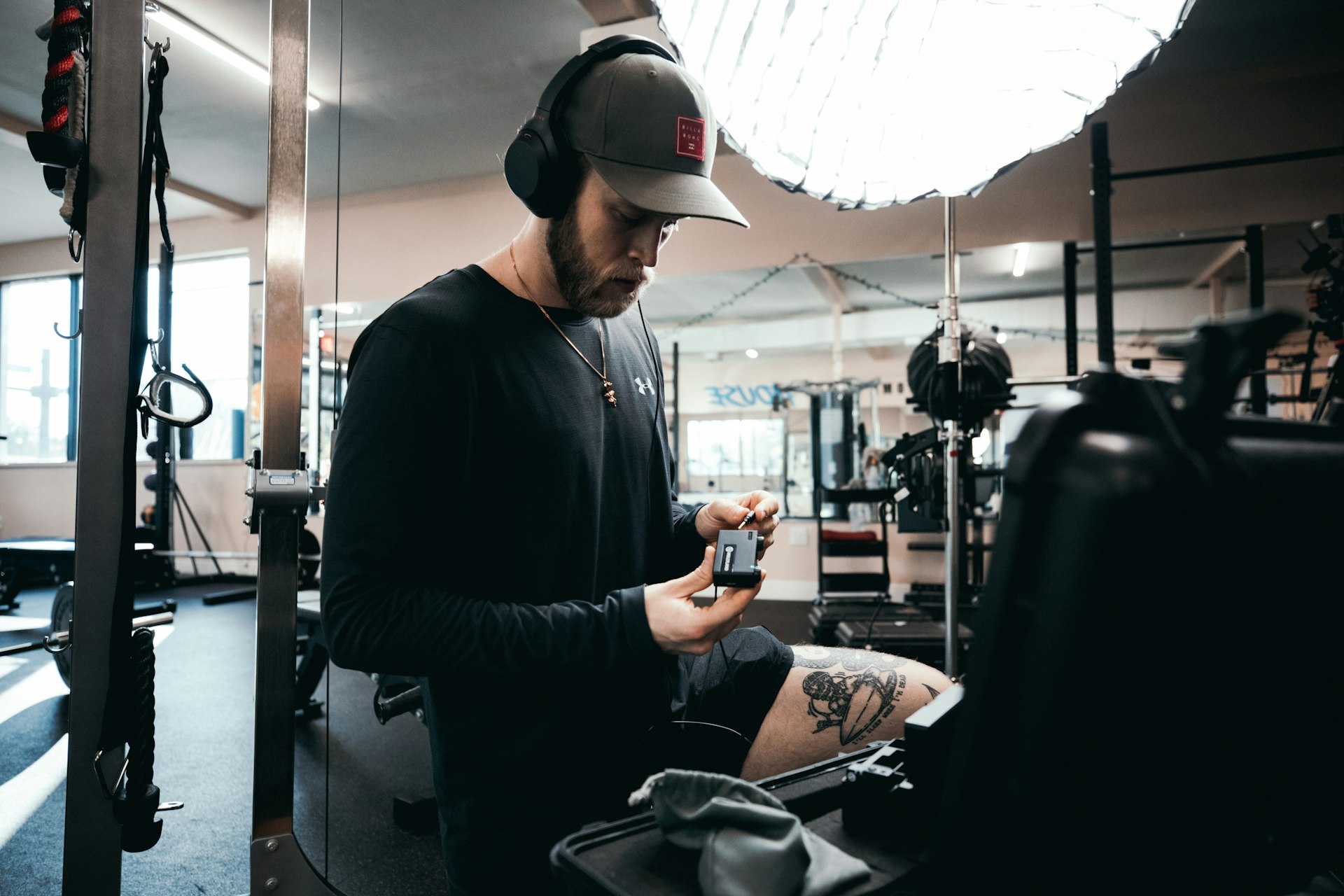 Person checking a workout app between work tasks