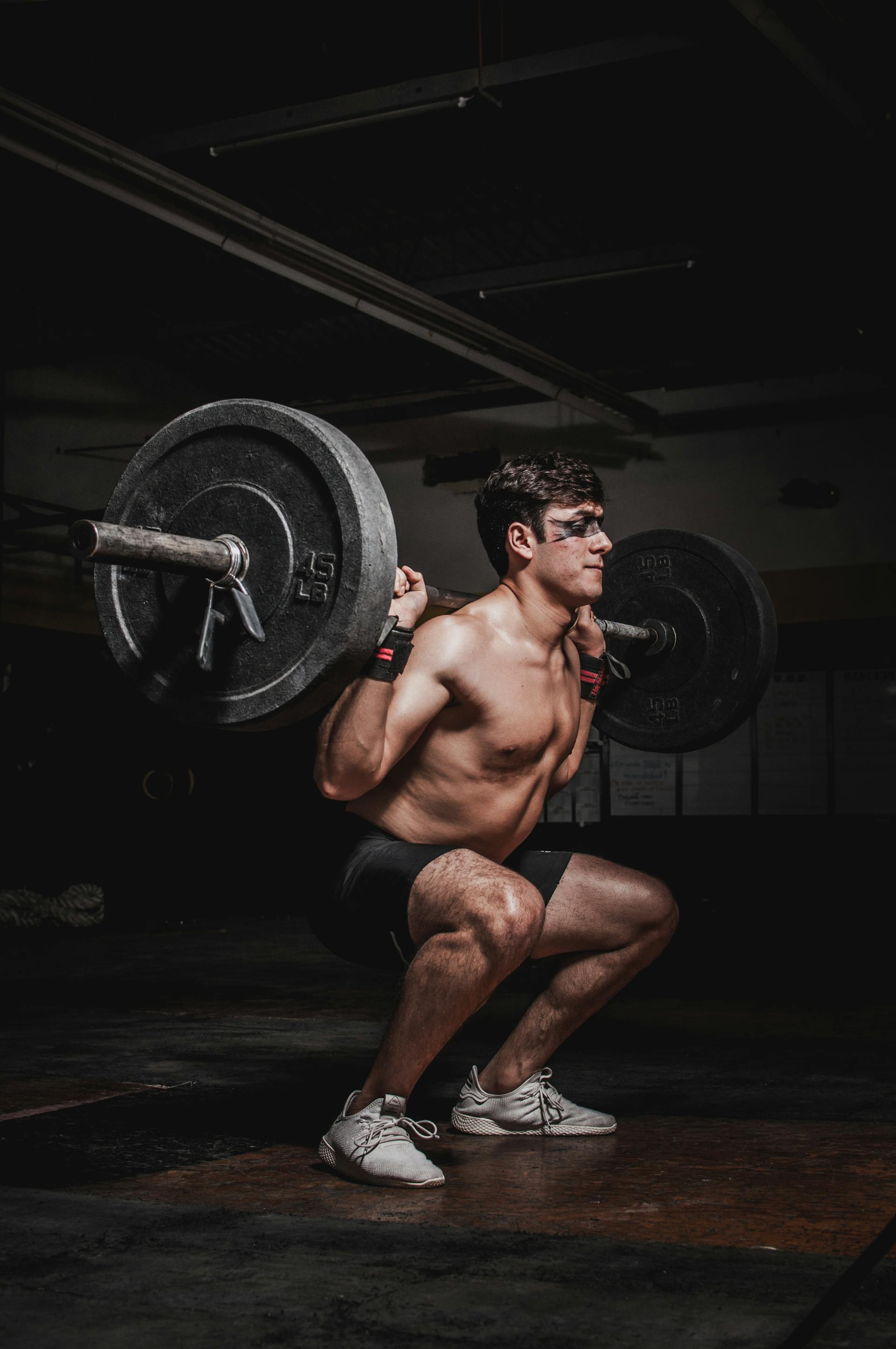 Person questioning fitness advice at a gym, surrounded by common workout equipment