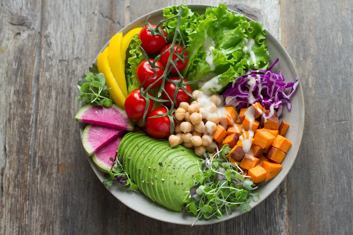 Person preparing healthy vegetables in a bright, modern kitchen